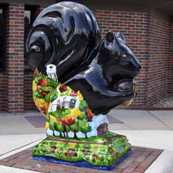 Statue of black squirrel with artistic design